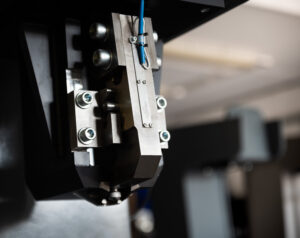 The indenter head of a metal hardness testing machine